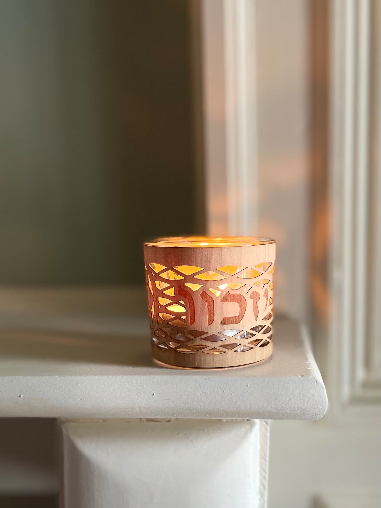 Yahrzeit/Yizkor memorial candle holder in a sleek, modern glass and wood design.