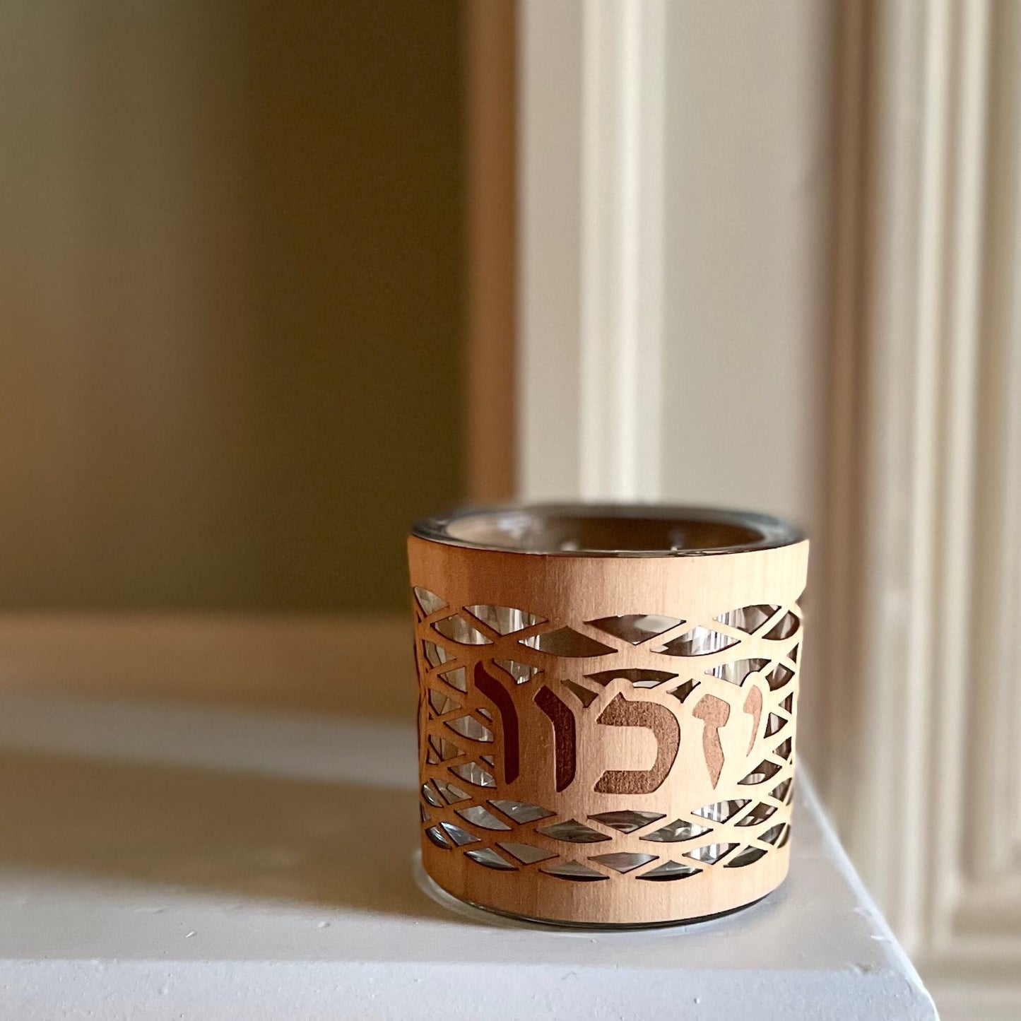 Yahrzeit/Yizkor memorial candle holder in a sleek, modern glass and wood design.