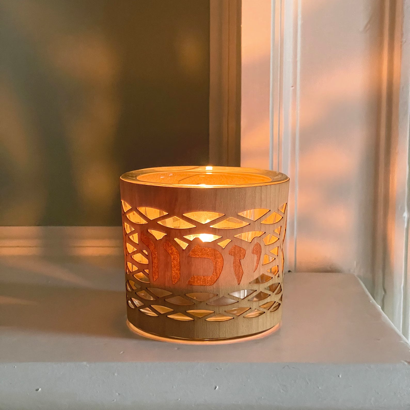 Yahrzeit/Yizkor memorial candle holder in a sleek, modern glass and wood design.