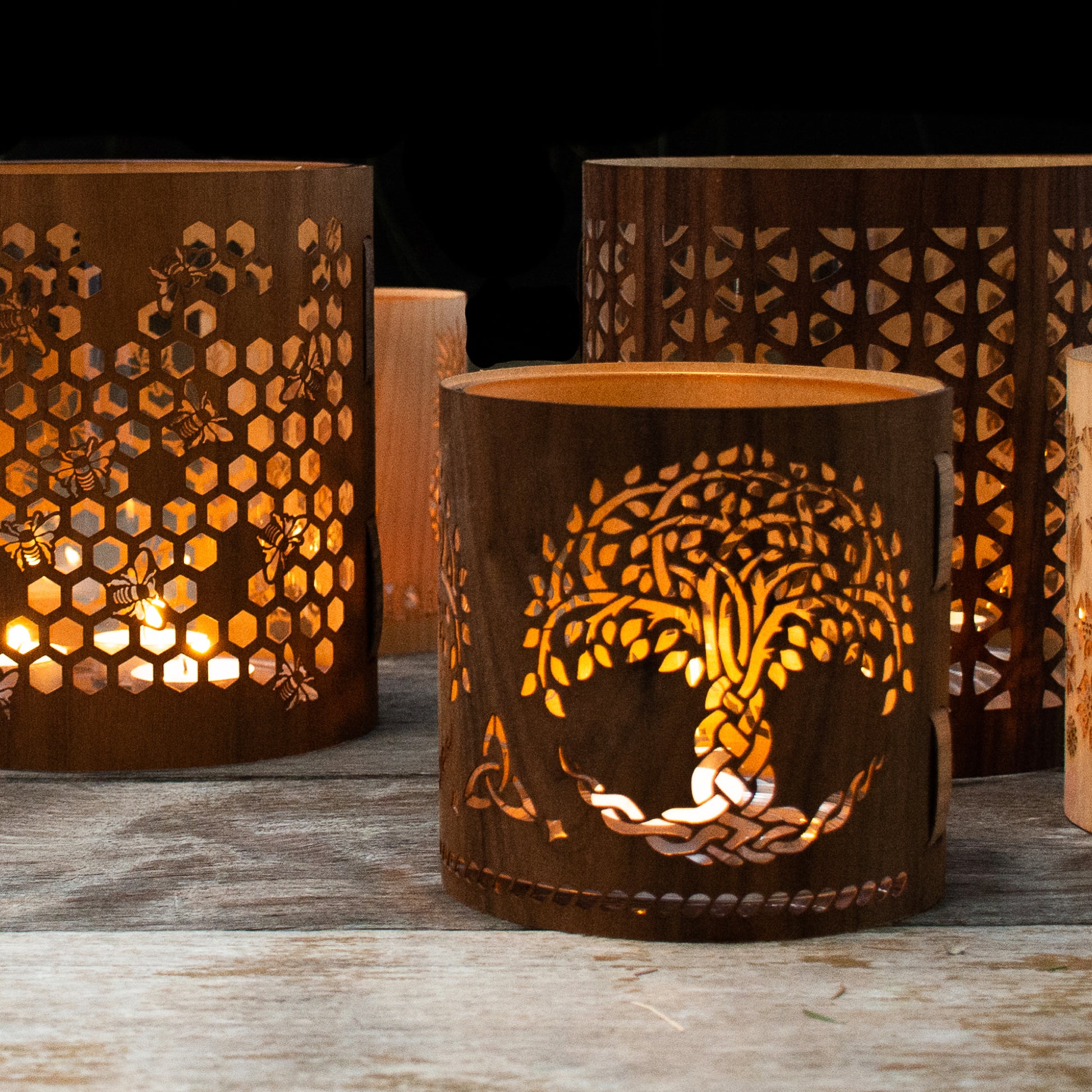 a tree of life lantern, medium Black Walnut, honeybee lantern in the rear