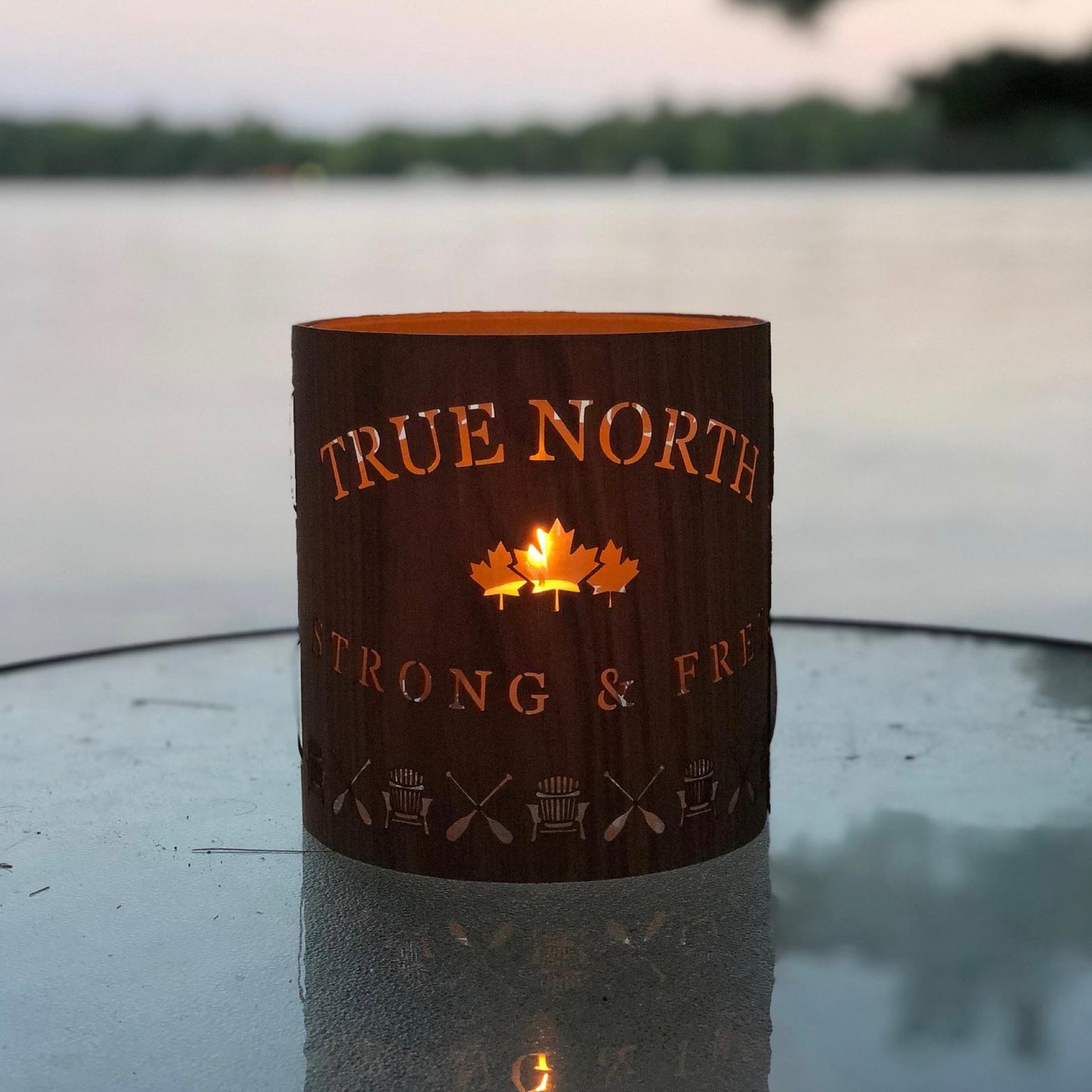 a true north lantern size large in Black Walnut on a glass table