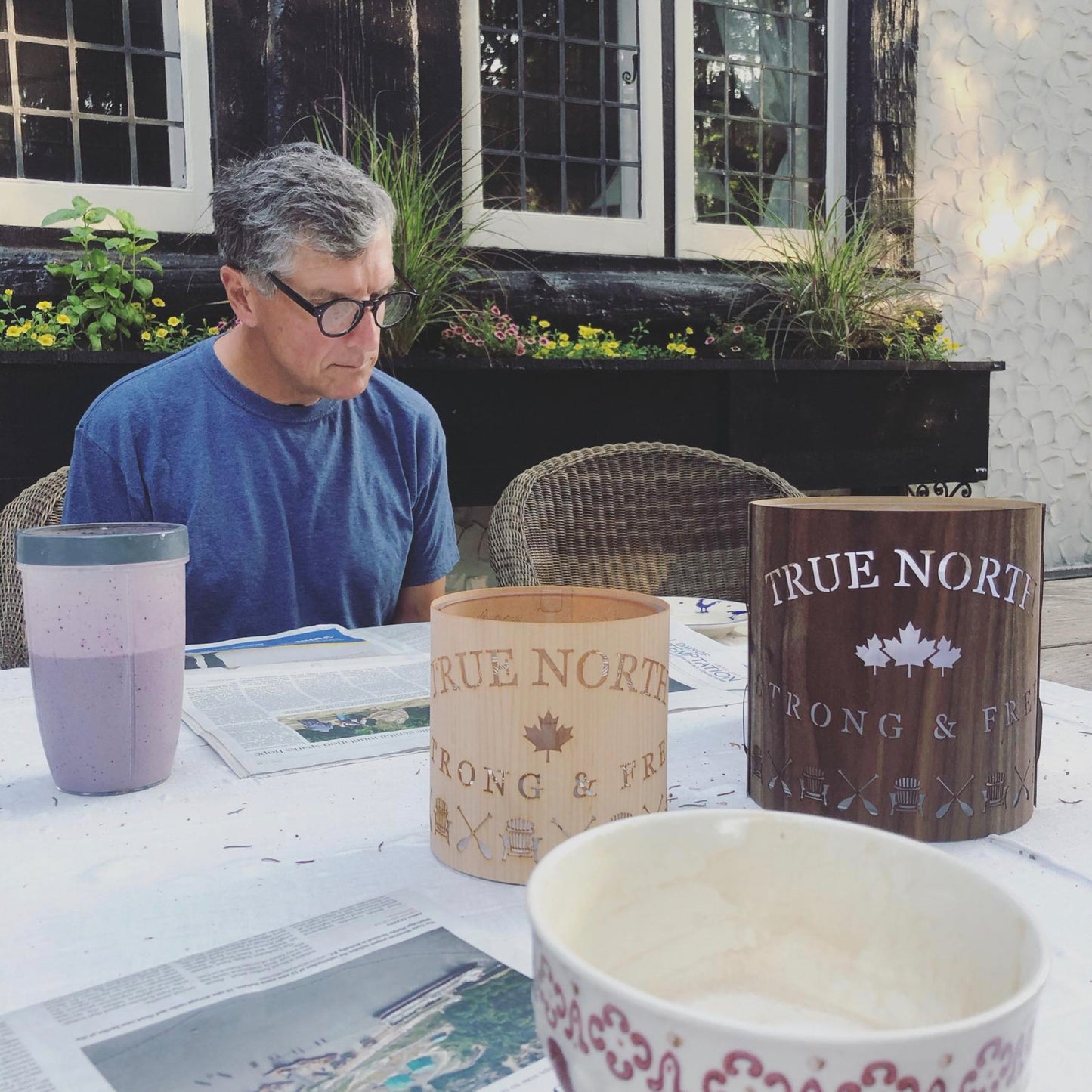 true north strong and free lanterns medium maple and large Black Walnut on the breakfast table in the garden