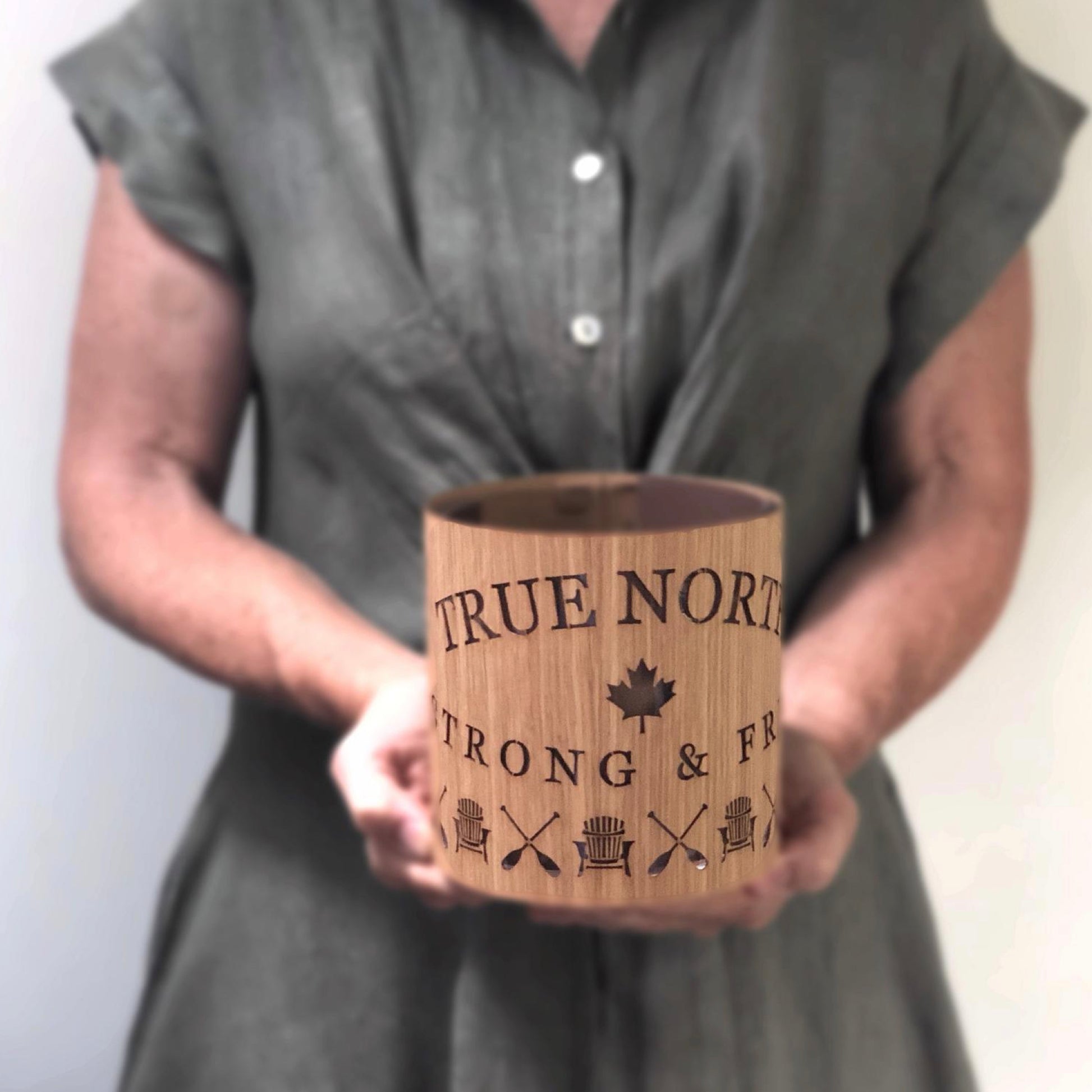 true north strong and free lantern being held by me