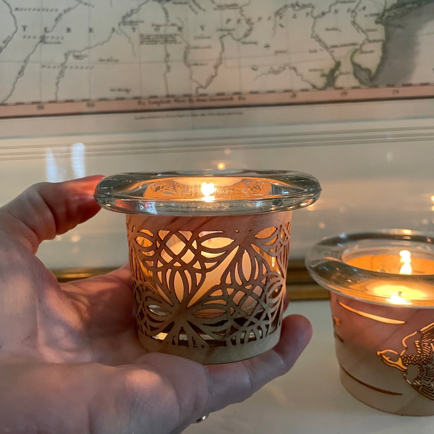 a tea light holder with a traditional design handmade in maple and glass