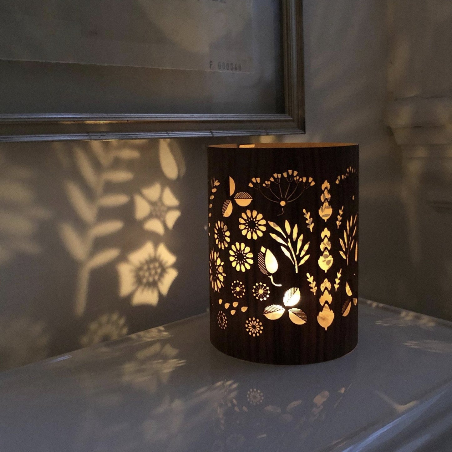 The floral lantern - size small in Black Walnut on the back of a toilet in my neighbour's loo