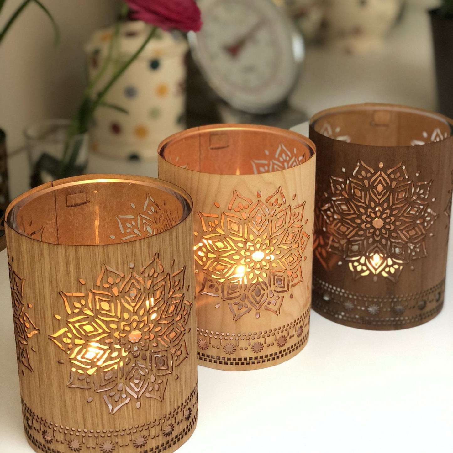 three small mandala lanterns in white oak, maple and black walnut