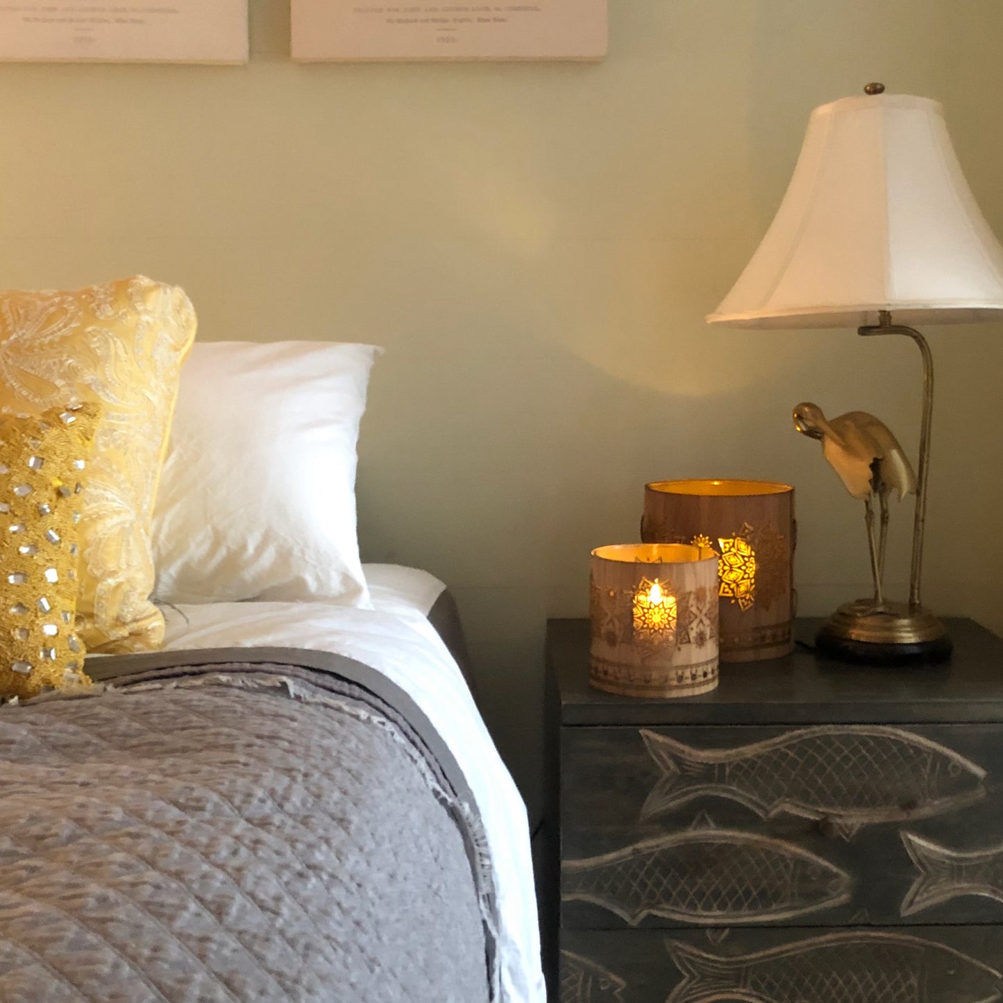 medium oak mandala and large walnut mandala lantern beside the bed in a home on Fleming street key west Florida - lemony picket