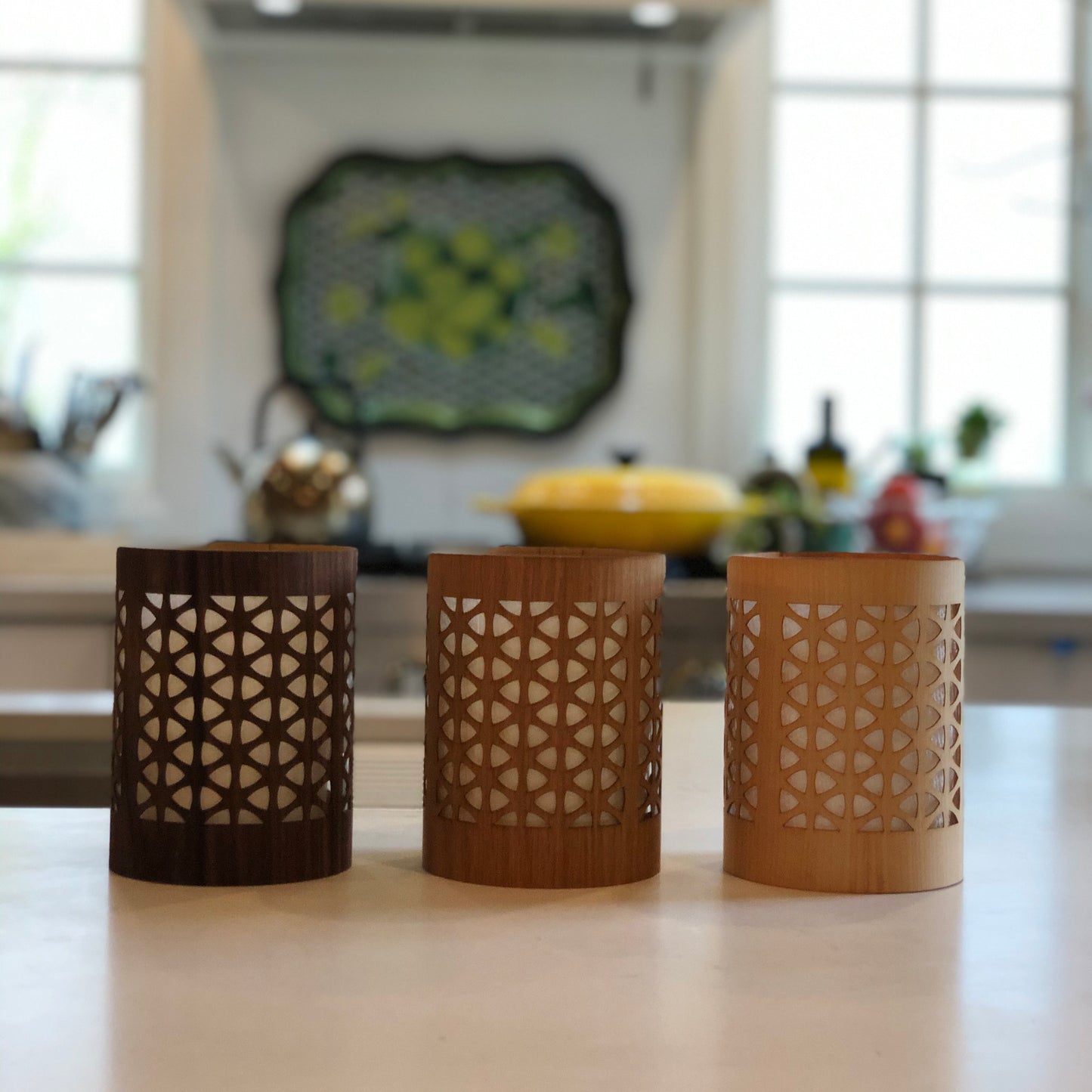 three mid-century modern lantern size small in black walnut white oak and maple in the kitchen