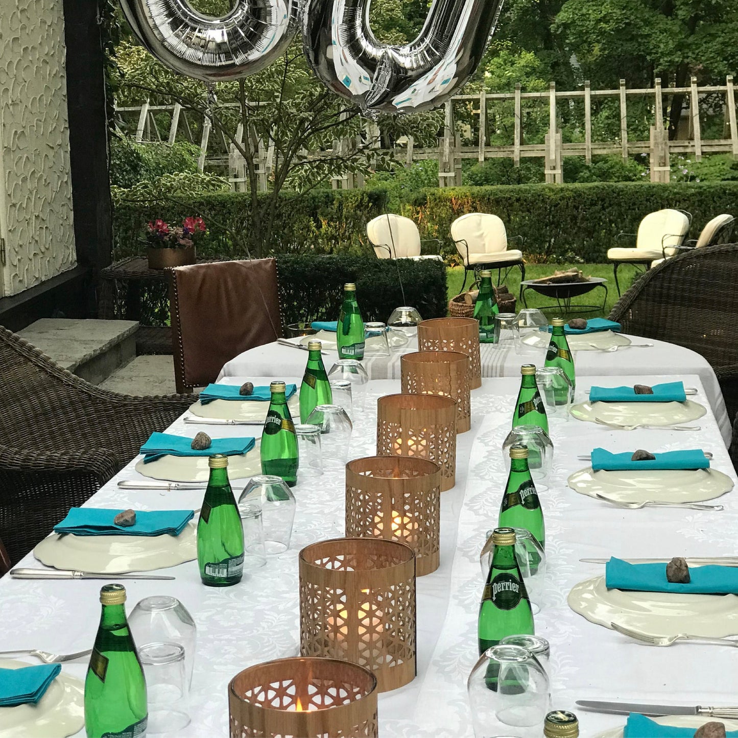 birthday table set out with a series of mid-century modern lanterns