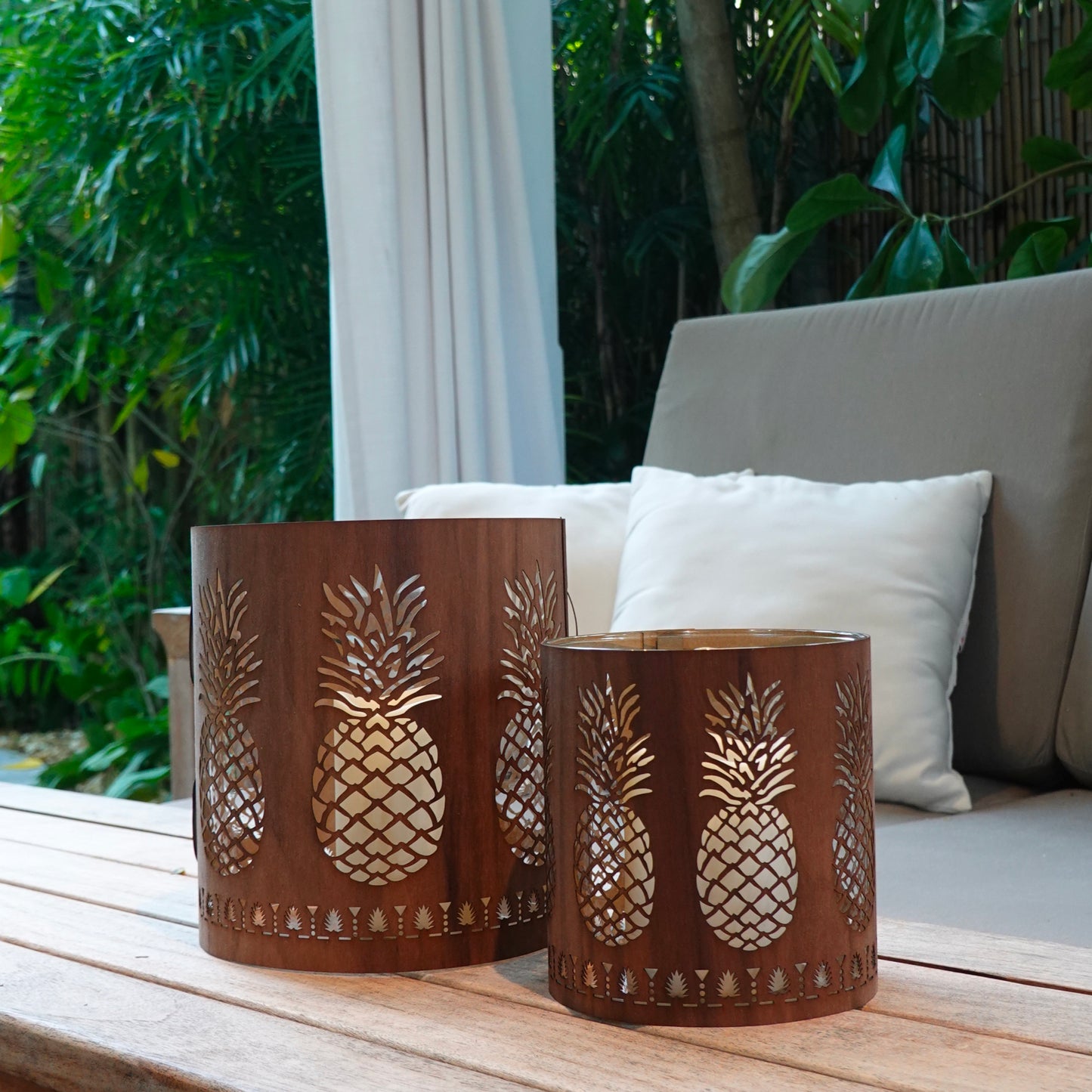 a large and a medium black walnut lantern on a lanai in Key West