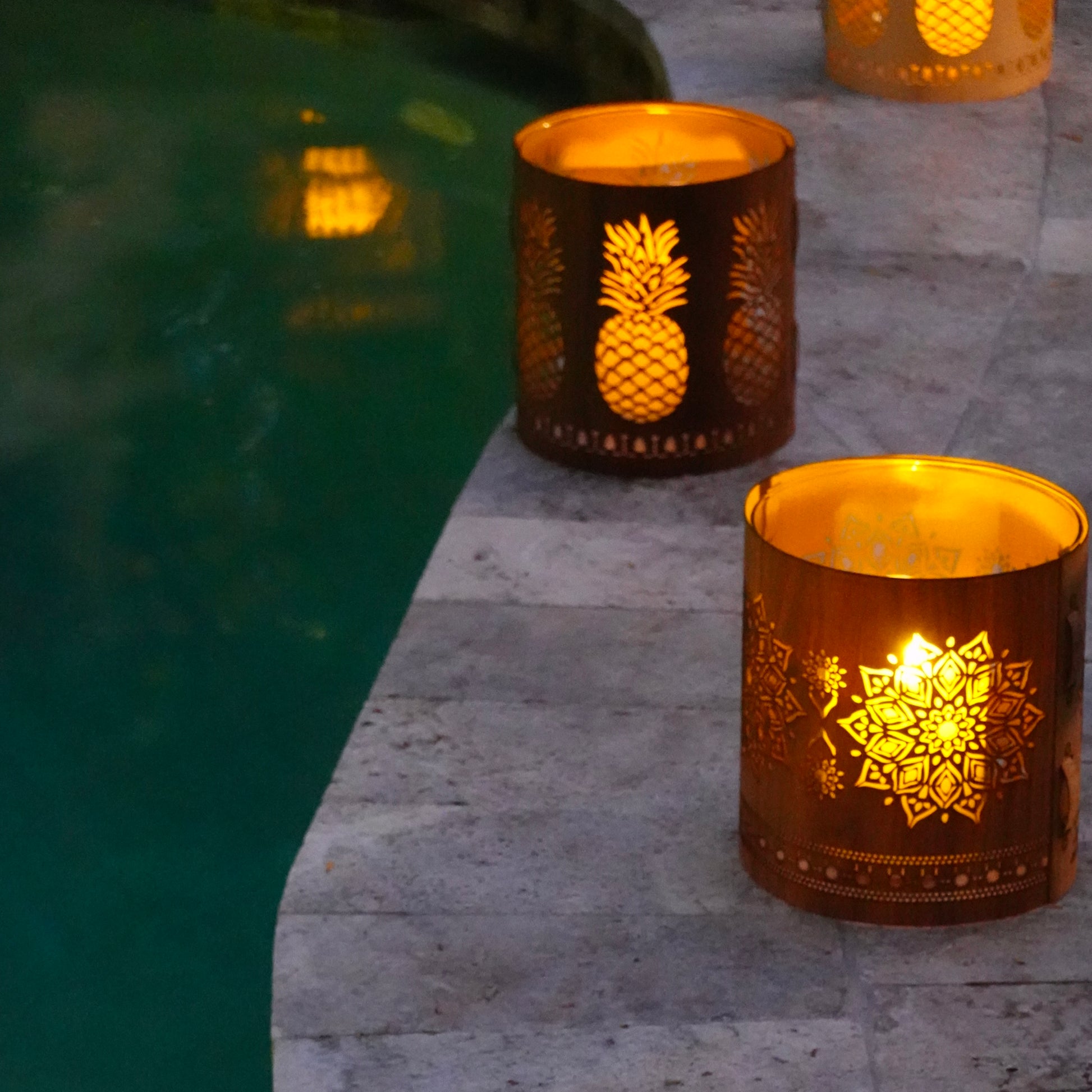 a large pineapple  lantern with the mandala by the pool in key west